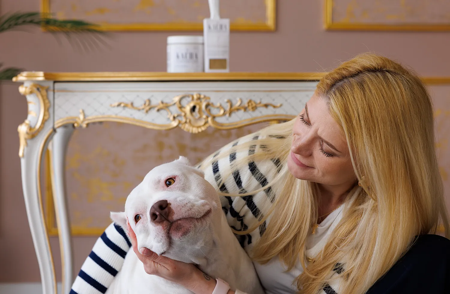 Katarina Hernandez holding a white dog